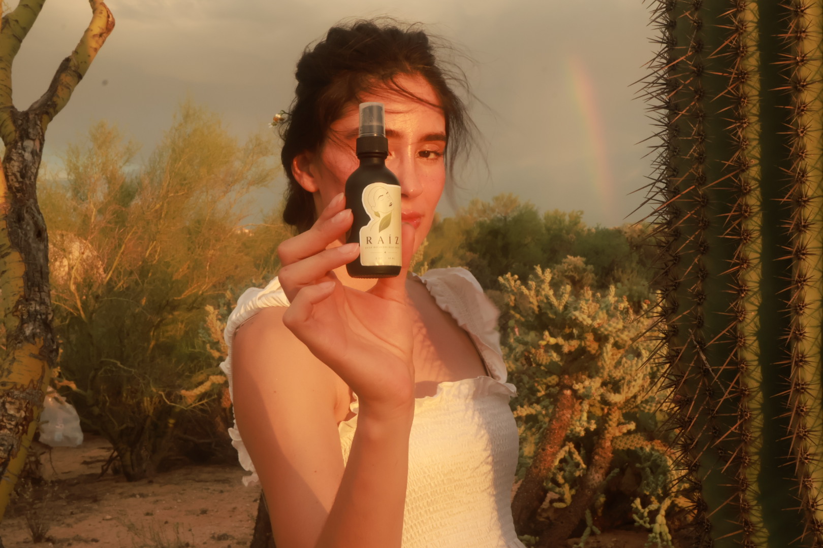 RAÍZ held in the light, made by hand in small batches